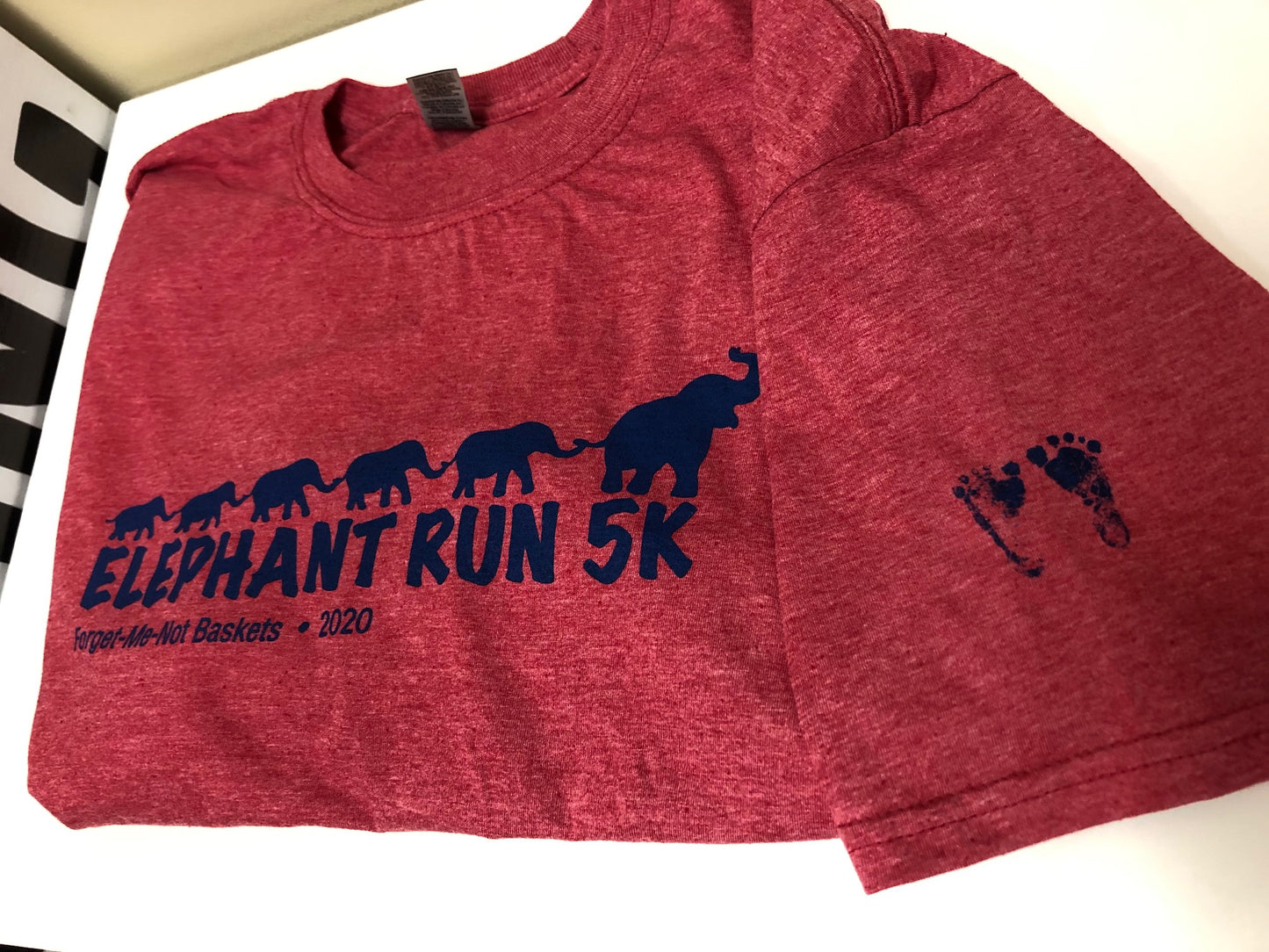 Elephant Run 2020 Short Sleeve T-shirt with footprints on sleeve